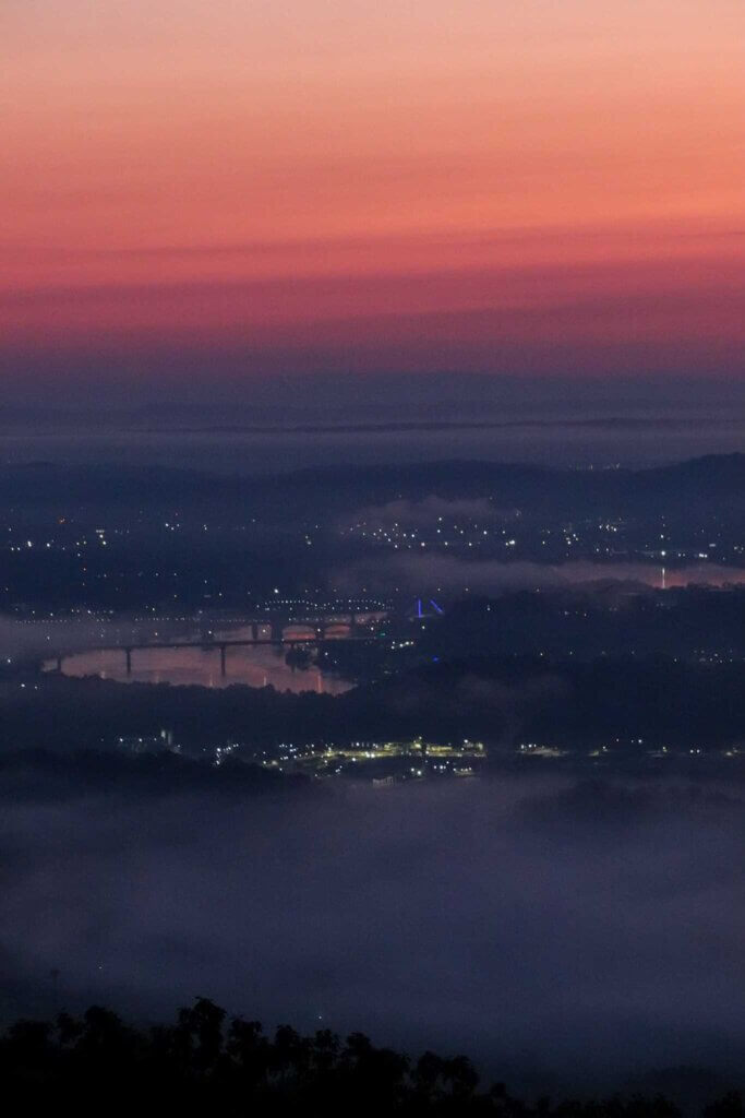downtown Chattanoooga against a sunrise background from the vantage point of the east overlook on raccoon mountain