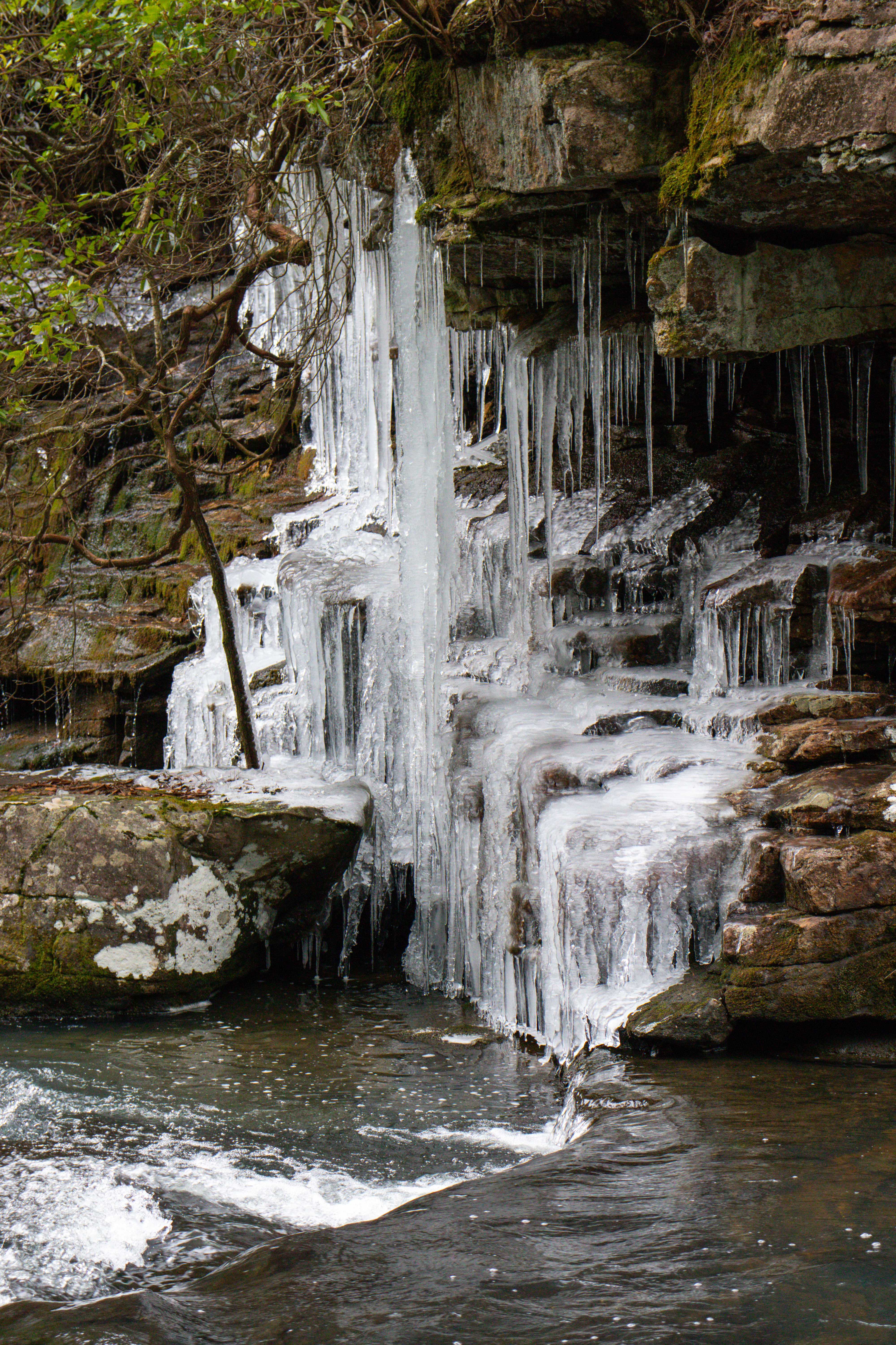 icicles on the rock wall lining savage creek